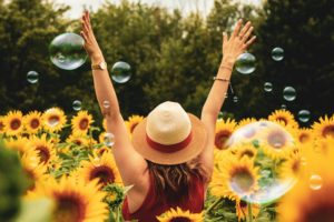 positive girl with sunflowers